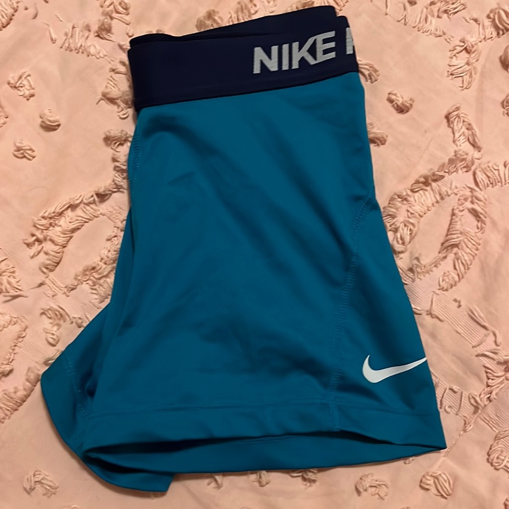 Blue and teal Nike Pros. I’ve only worn maybe twice